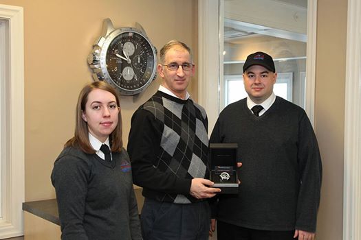 From left, Instructor Madeline Koby, winner Gaetan Boudreau and Brampton Flight Centre 's Rob Carney.