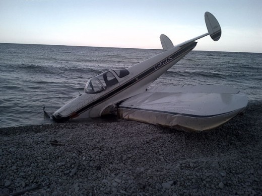 A Canadian Ercoupe was damaged in a beach landing on a Lake Michigan Island.