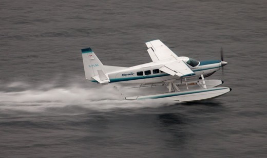 A Seair Caravan pilot reported coming within 10 feet of a UAS.