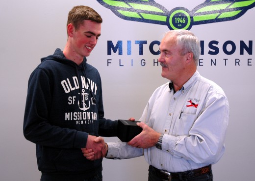 Josh Kerr accepts Hamilton watch from Malcolm McLeod.